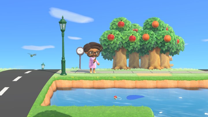 Holding fishing rod in Animal Crossing: New Horizons.