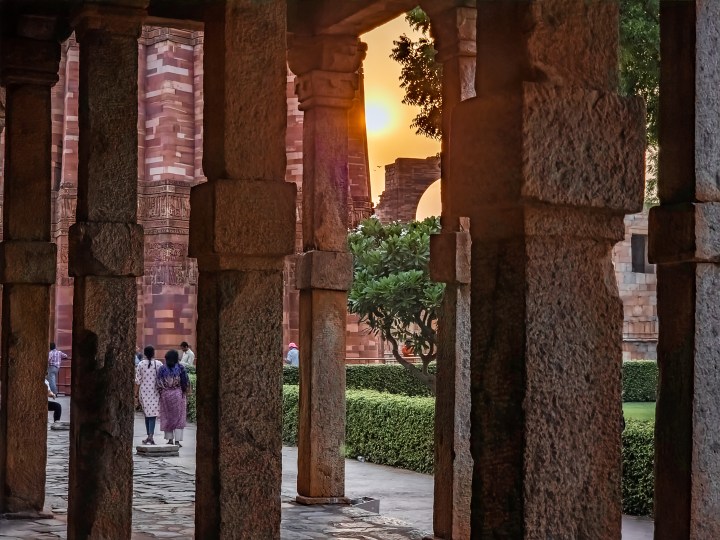 Edited image of the sun through pillars near the Indian monument Qutub Minar shot on the Samsung Galaxy S22 Ultra in RAW.