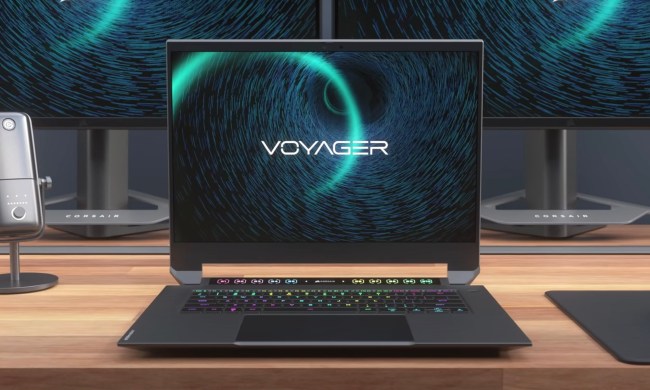 A Corsair Voyager gaming laptop sits on a desk.