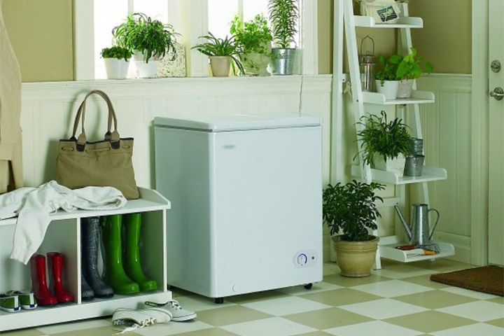The Danby compact freezer in a room.