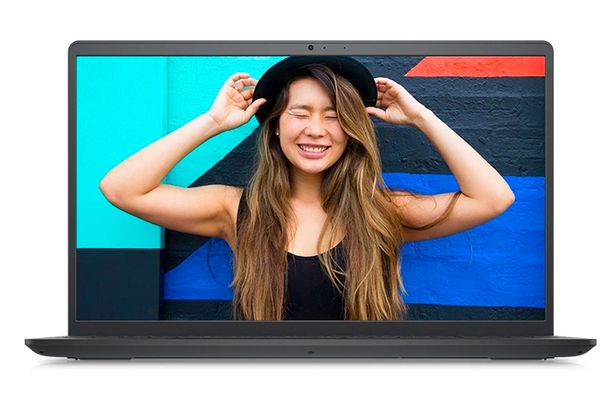 The Dell Inspiron 15 3000 laptop front-facing and displaying an image of a woman smiling.