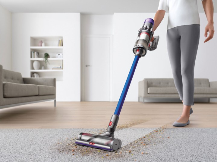 Dyson V11 Torque Drive cordless vacuum cleaning hard floor and carpeting.