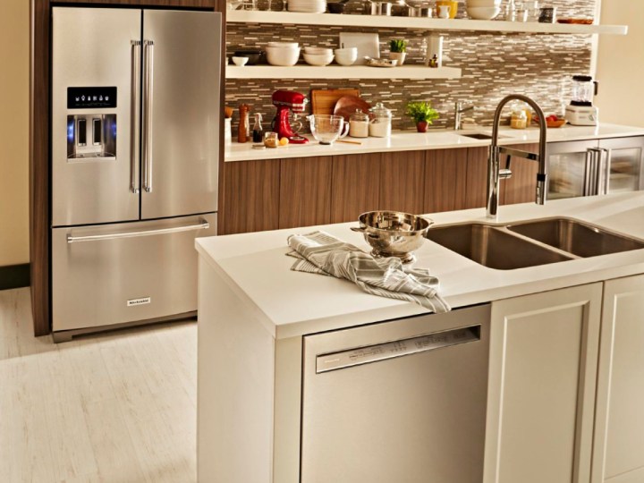 KitchenAid 4-piece kitchen appliance package in a light brown kitchen setting.