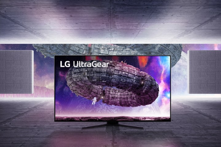 Monitor LG UltraGear su uno sfondo futuristico.