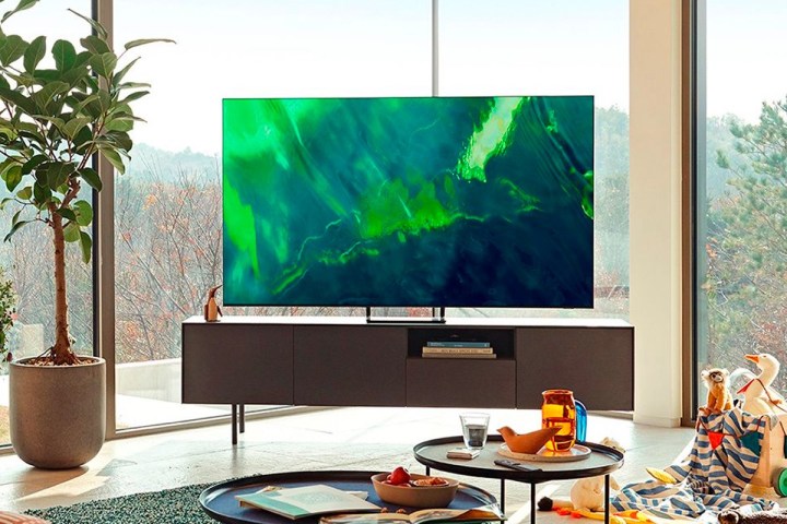 A Samsung 65-inch QLED 4K smart TV sets in a living room.