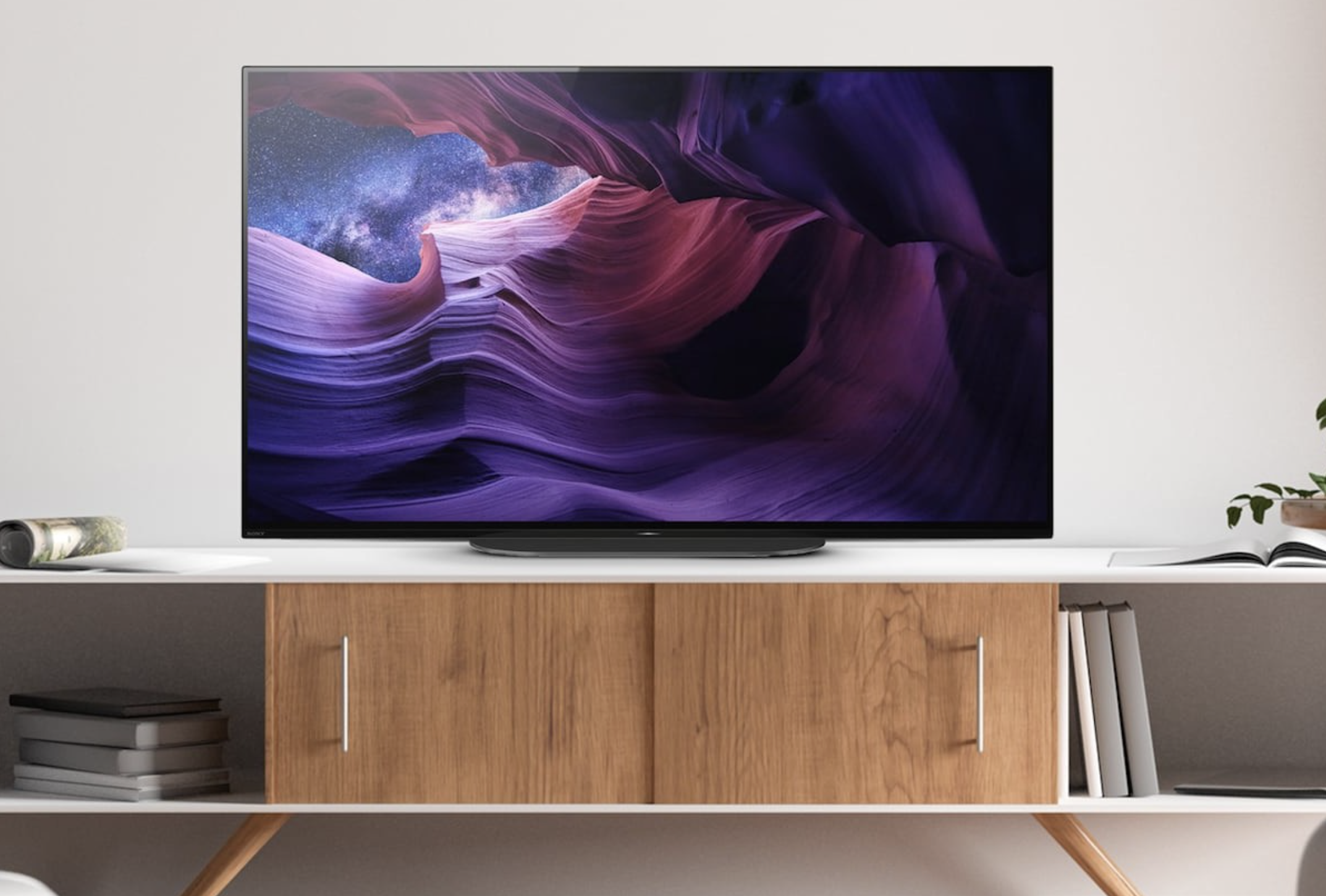 Sony A9S TV placed on a TV unit in a living room.