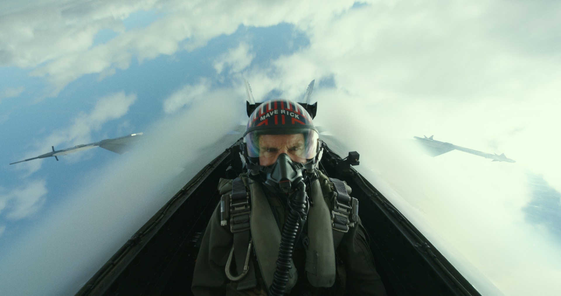 Tom Cruise pilots a jet.