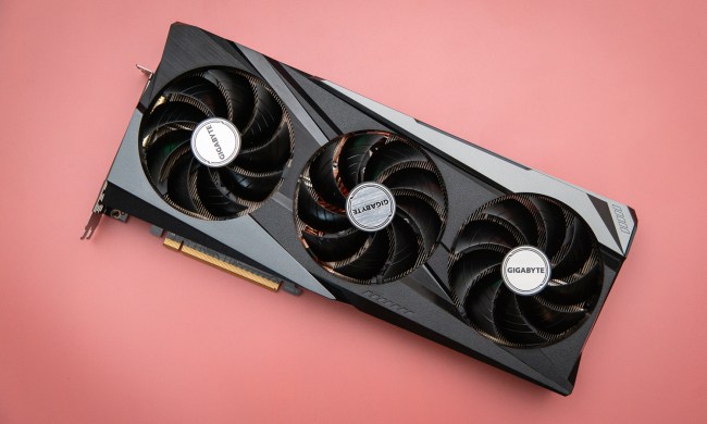 AMD RX 6950 XT graphics card on a pink background.