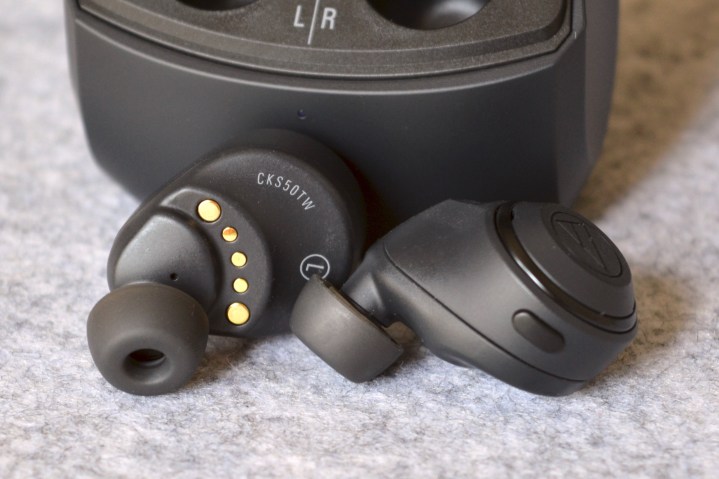 Audio-Technica ATH-CKS50TW wireless earbuds seen in front of their case.