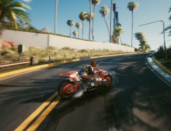A motorcycle drifting around a turn.
