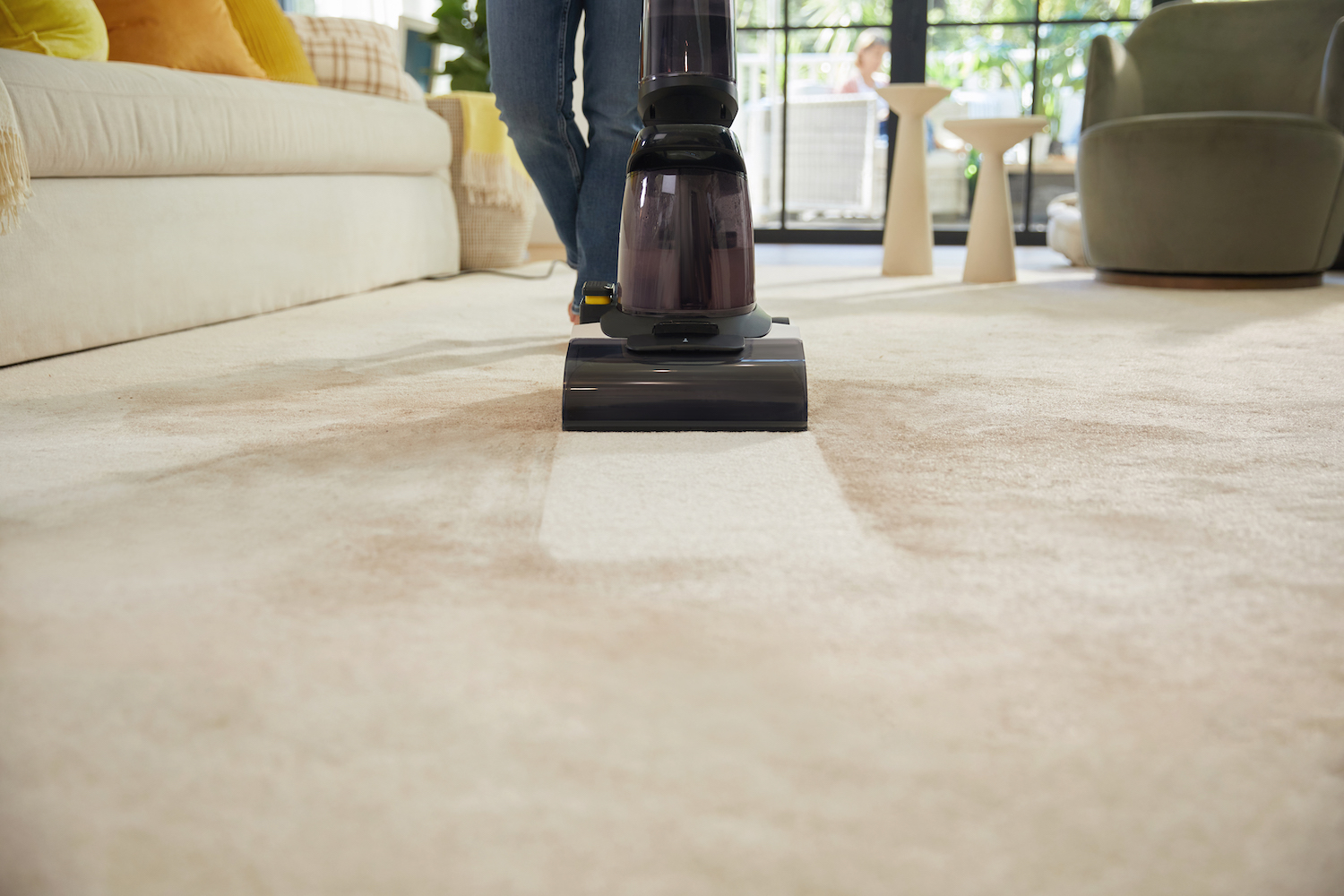 The Tineco Carpet One cleans a dirty floor.