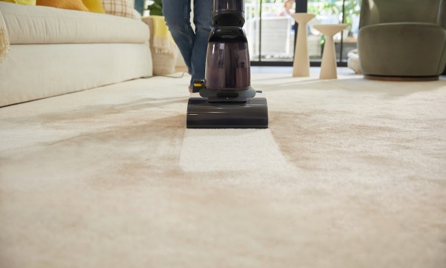 The Tineco Carpet One cleans a dirty floor.