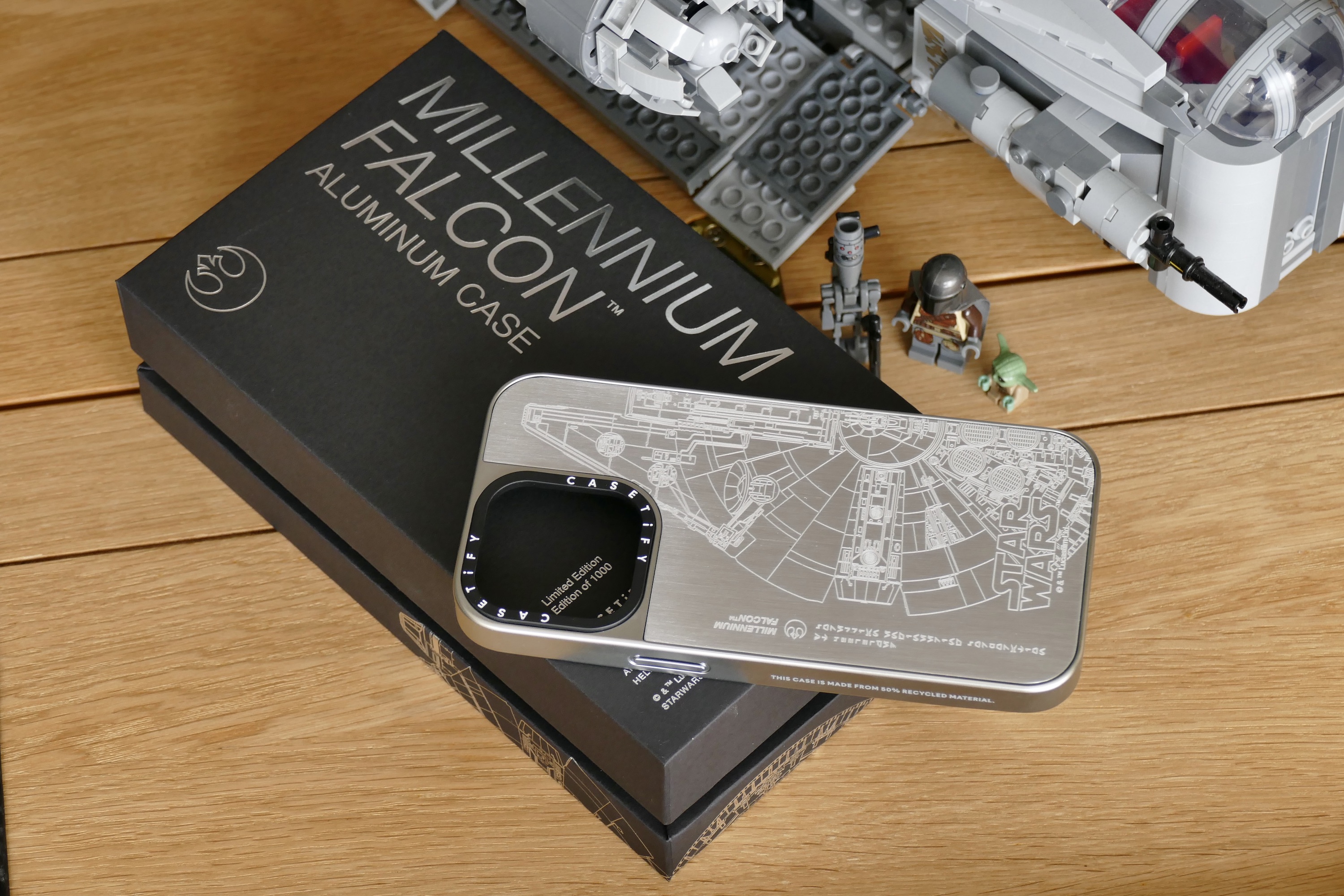 Casetify's metal Millennium Falcon iPhone case with its box.