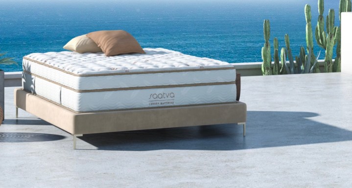 A Saatva Classic Mattress on patio by the water.