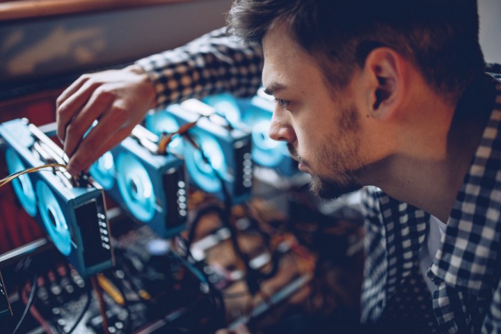 A programmer preparing a crypto currency mining rig