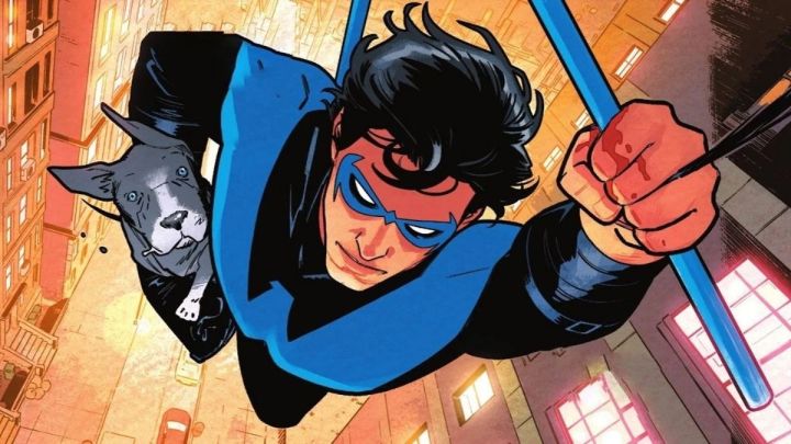 Nightwing jumping from a building while carrying Haley the dog in the comics.
