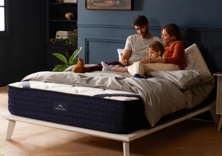 This is an image of a family snuggled together on a Dream Cloud bed.