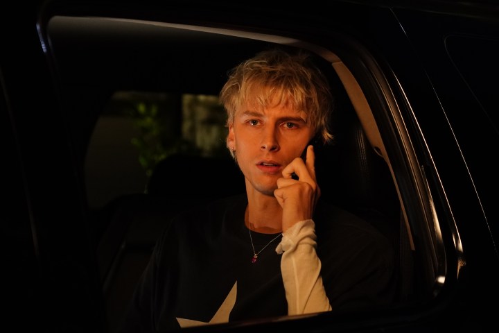 Machine Gun Kelly on his phone in a still from Good Mourning.