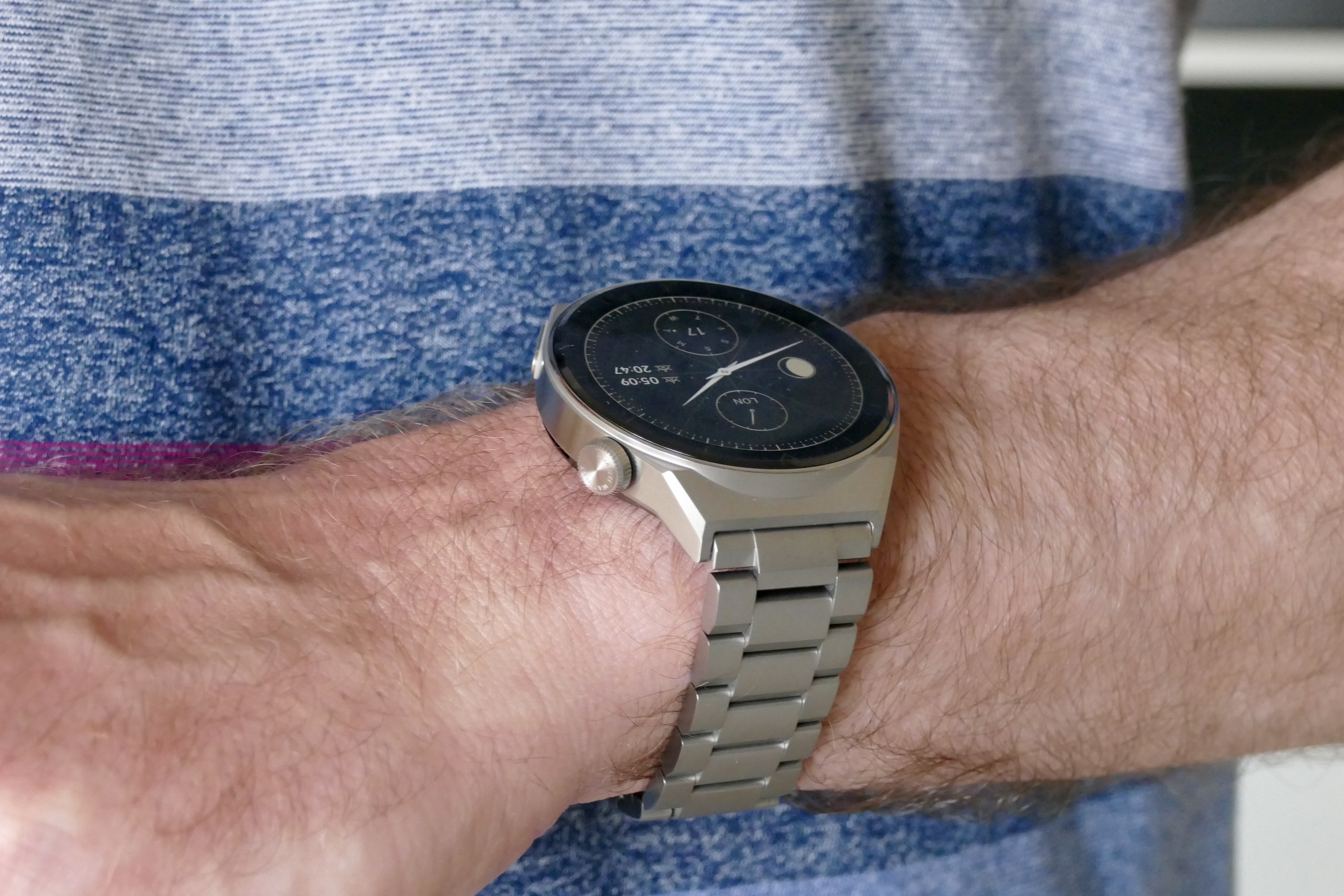 Huawei Watch GT 3 Pro Elite's titanium bracelet and screen on a wrist.