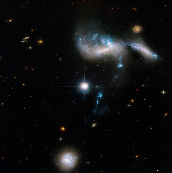 This newly revised NASA Hubble Space Telescope image of the Hickson Compact Group 31 (HCG 31) of galaxies highlights streams of star-formation as four dwarf galaxies interact.