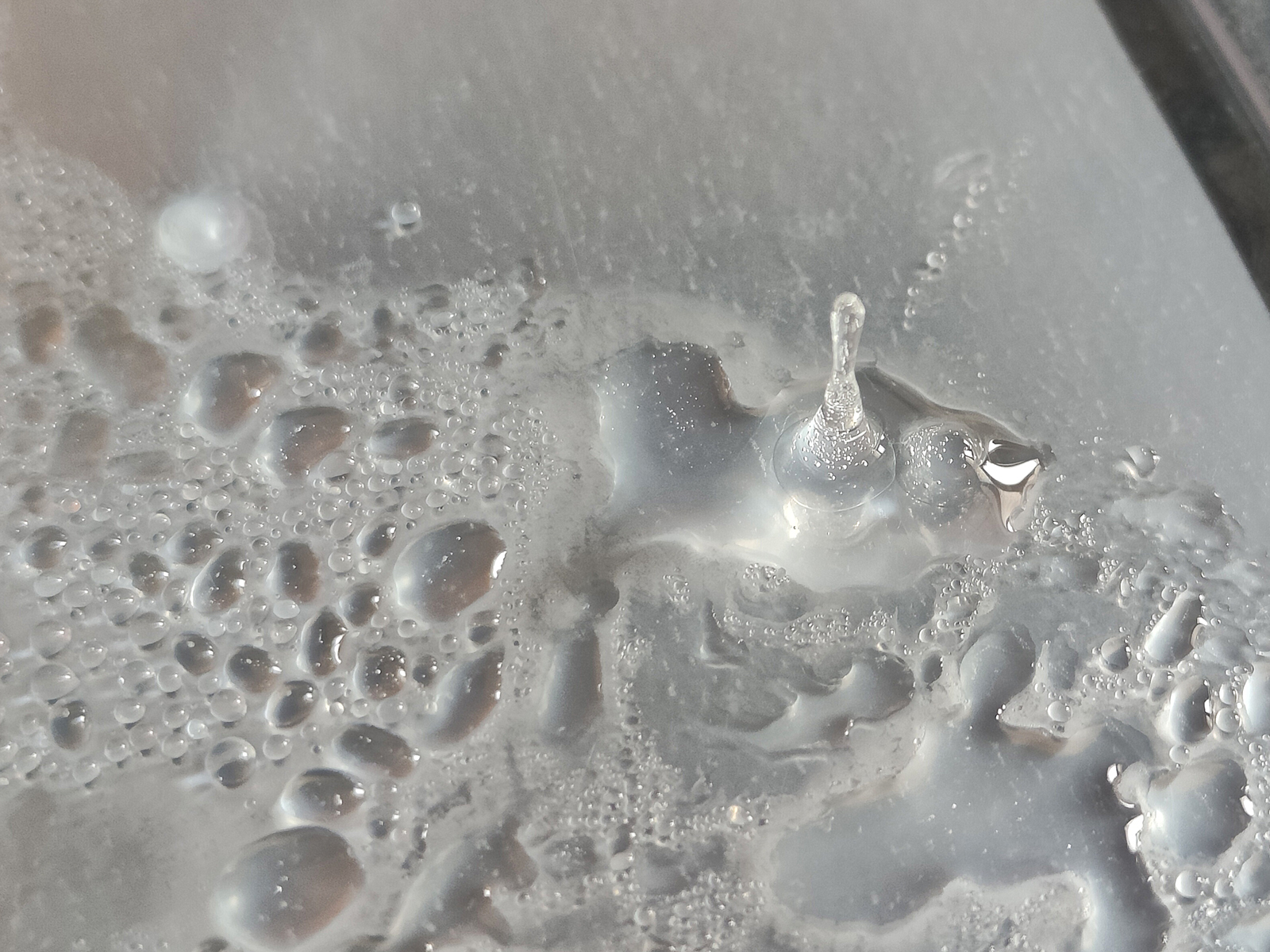 An icicle frozen on a container lid photographed with the Realme GT 2 Pro's primary 50MP camera.