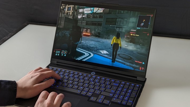 Playing a game on the Lenovo Legion Slim 7i gaming laptop.