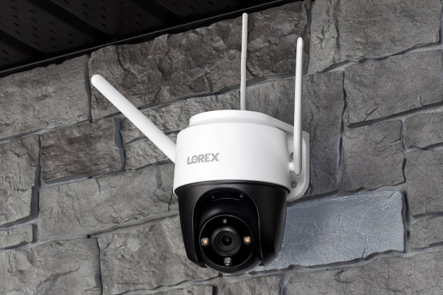 Lorex 2K Pan-Tilt WiFi Outdoor Security Camera mounted on stone wall.