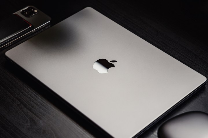 MacBook Pro in space grey sitting on a desk.