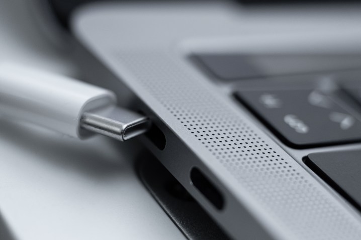 Close up on the USB-C ports on a Macbook Pro.