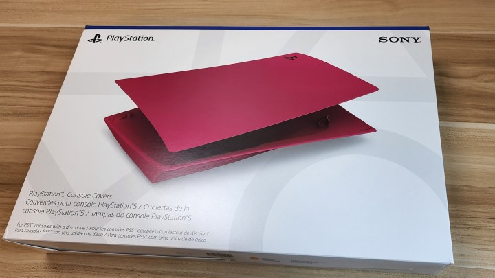 A new red cover for a PS5 in an unopened white box.