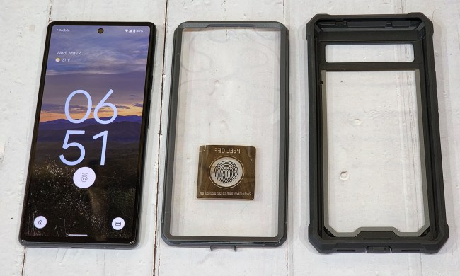 Pixel 6 on a table next to two parts of a Pixel 6A case.