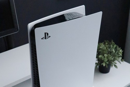 The Playstation 5 system standing upright.