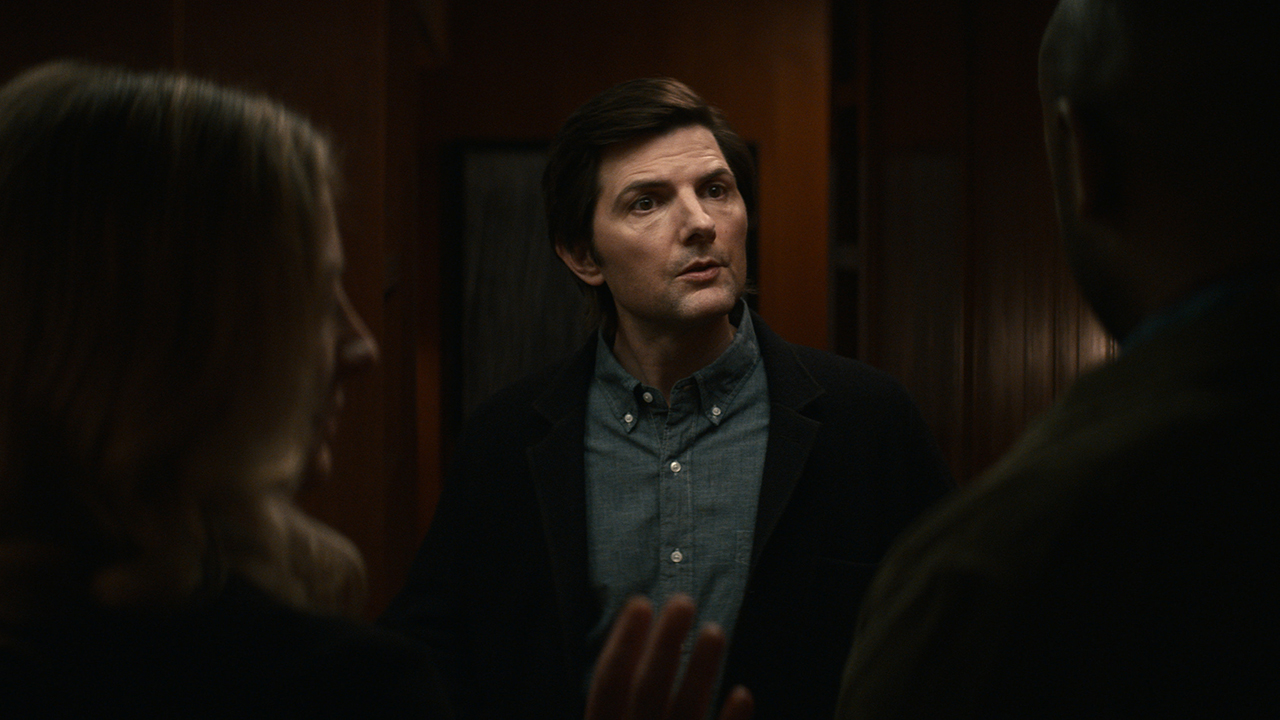 Mark talking to his brother-in-law and Harmony in a scene from Apple TV+'s Severance.