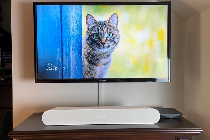 The Sonos Ray soundbar in white seen below a 32-inch TV.