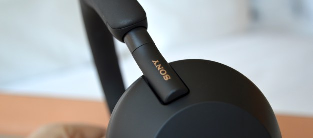 Close-up of earcup on Sony WH-1000XM5 wireless headphones.