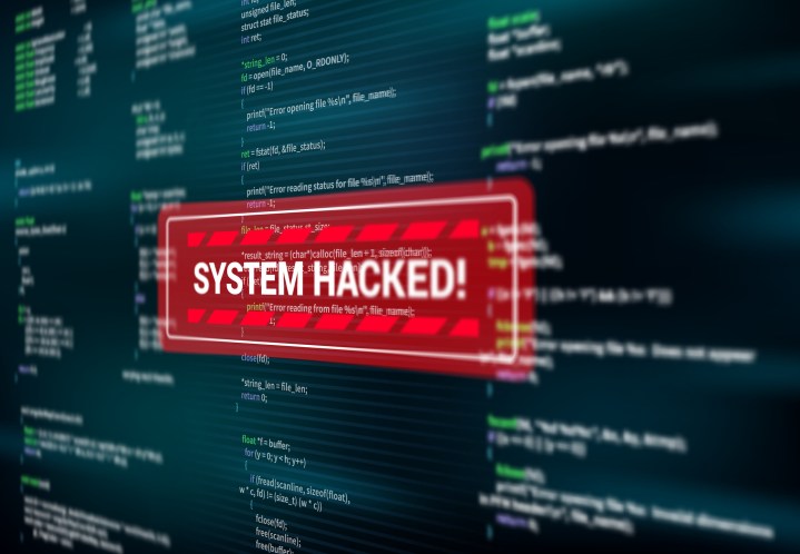 A system hacked alert alert is being displayed on the computer screen.
