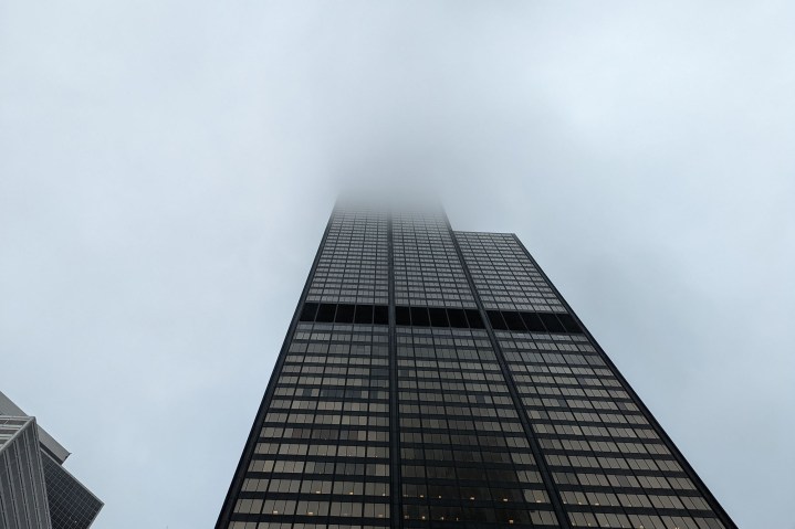 The Willis Tower extends into a low cloud bank.
