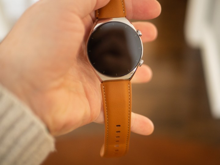 Hand holding the Xiaomi S1 smartwatch
