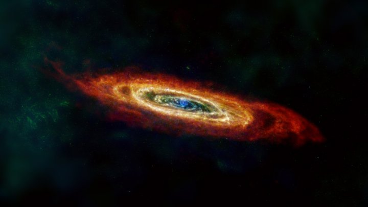 La galaxia de Andrómeda, o M31, se representa aquí en las longitudes de onda de luz del infrarrojo lejano y de radio.