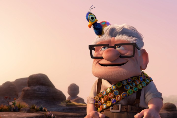 Carl Frederickson looks upwards with a bird resting on his head in Up (2009).