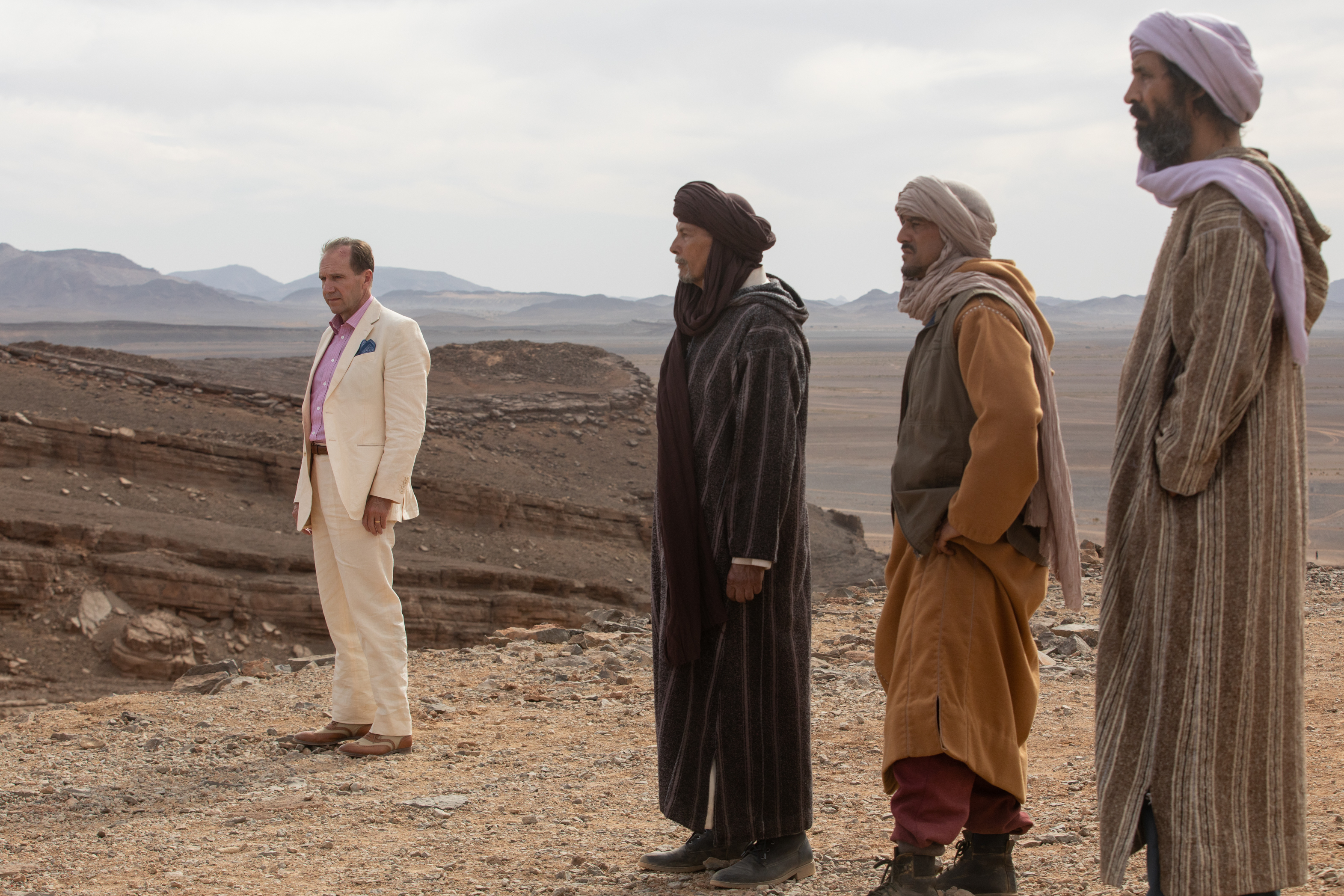 David stands in the desert with Abdellah and his men in The Forgiven