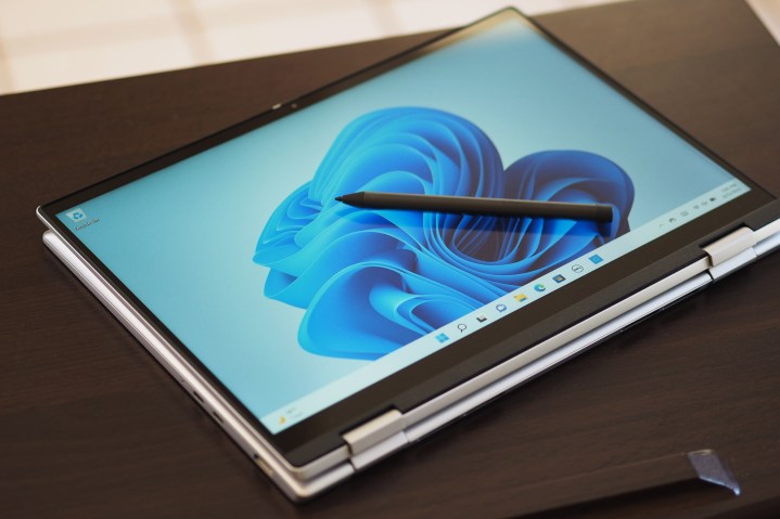 Dell Inspiron 14 2-in-1 lies folded in tablet position on a table.