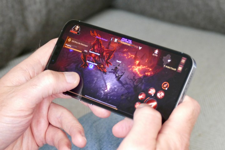 Plays Diablo Immortal on iPhone 13 Pro.