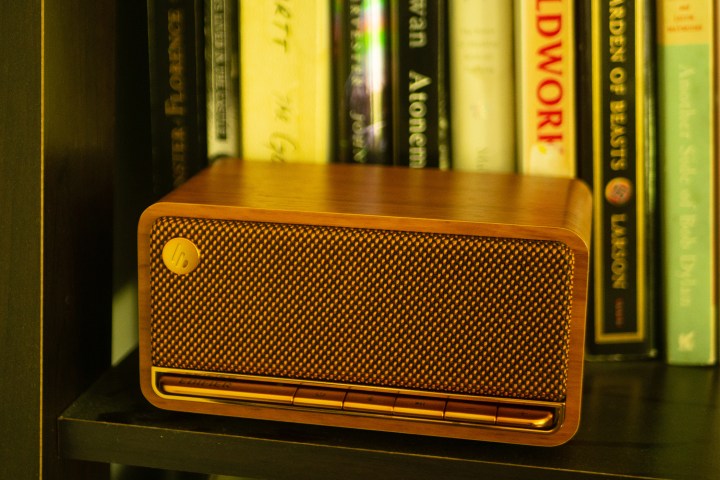 Edifier's MP230 Speaker is sitting on a shelf in front of some books.