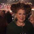 The Sanderson sisters smiling while at a fair in Hocus Pocus 2.