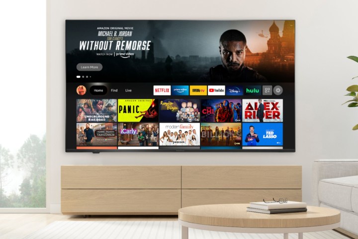 The Insignia F50 Series QLED 4K TV with the Amazon Fire TV interface on the screen.