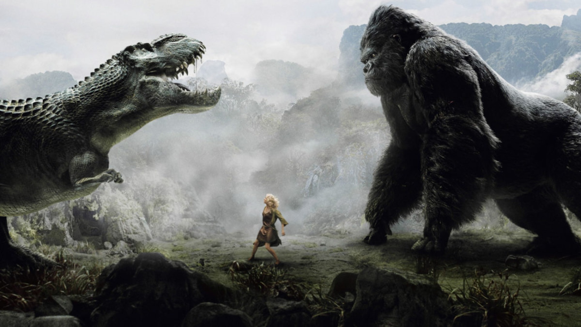 Naomi Watts como Ann Darrow presa entre um V-Rex e King Kong.