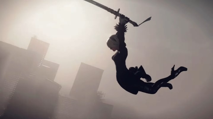 2B jumping with sword in hand in Nier Automata.