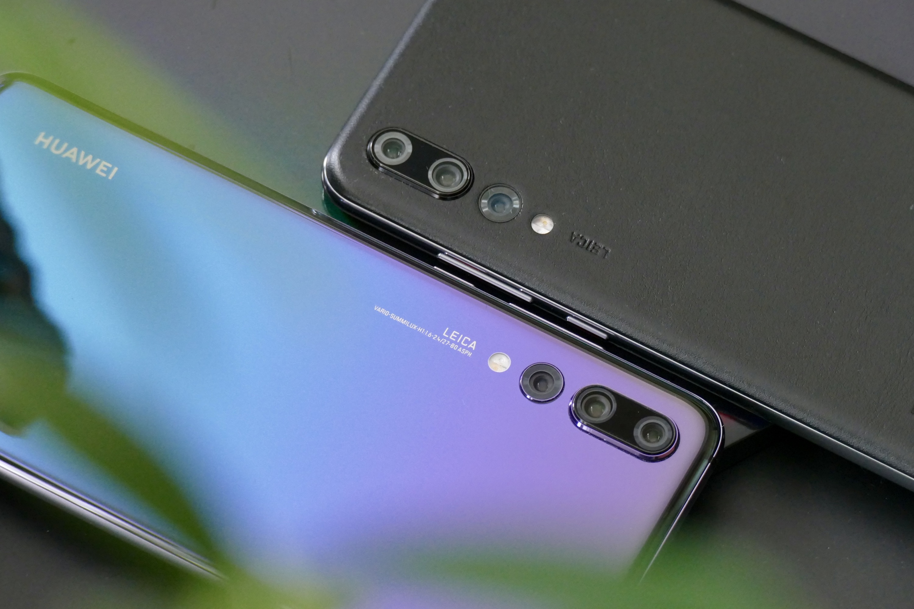 Huawei P20 Pro and P20 Pro in leather, showing the Leica cameras.