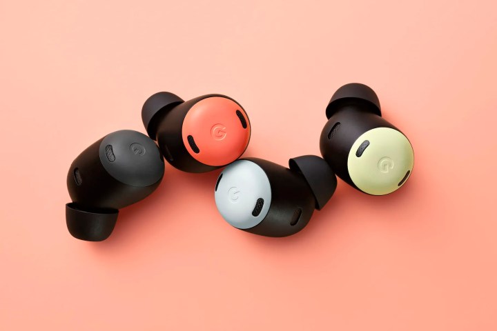 Four individual Pixel Buds Pro headphones sit on a pink background.